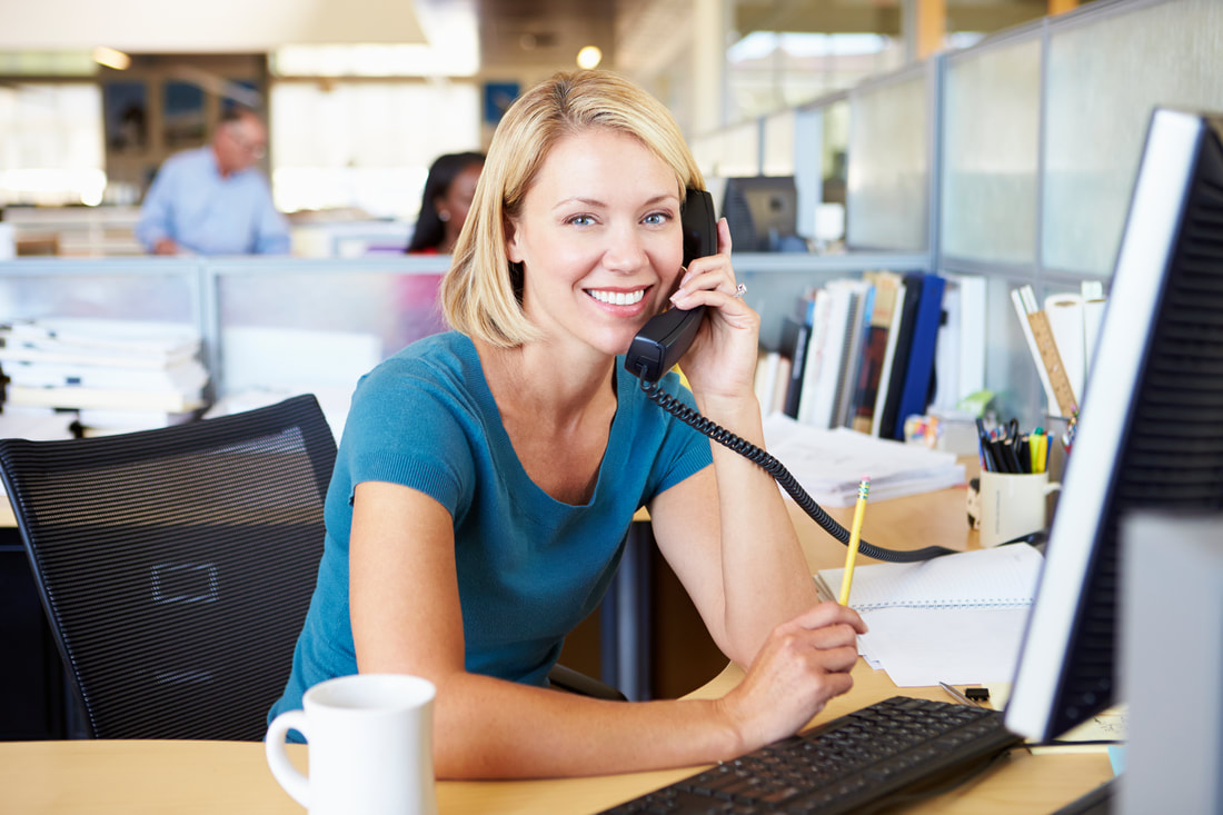 Receptionist answering the phone at Stucco Repair Miami
